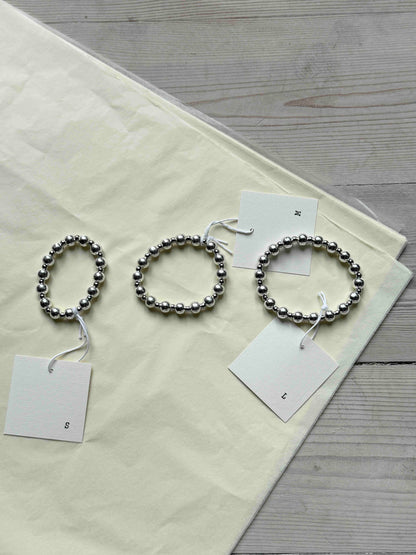 AMANDA-BUGGE-studio-vela-bracelets-in-silver-the-3-sizes-compared-to-each-other