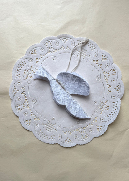 White lace Christmas bird in textile by AMANDA BUGGE studio with a strap
